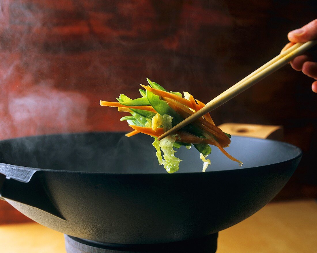 Chopsticks with vegetables from the wok
