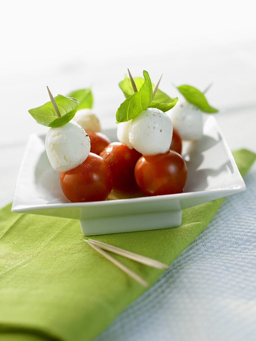 Cherry tomatoes with mozzarella and basil