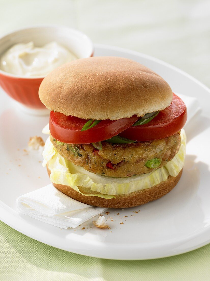 Tuna burger with lettuce, tomatoes and mayonnaise