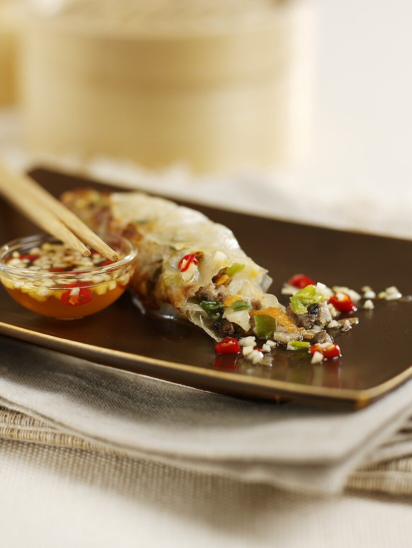 Spring roll with nuoc cham (chili sauce, Vietnam)