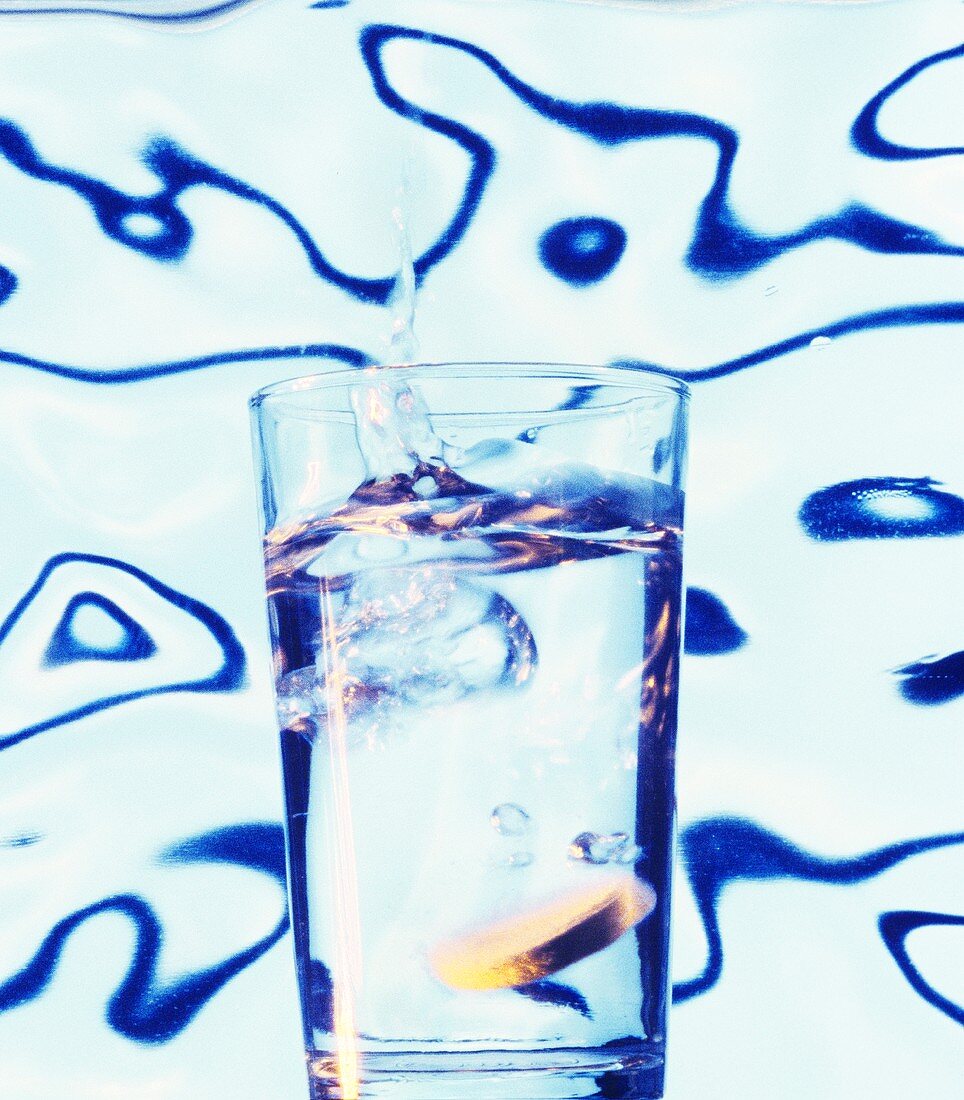 Effervescent tablet being dissolved in a glass of water