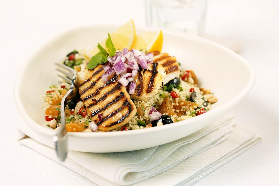 Grilled turkey strips on couscous salad