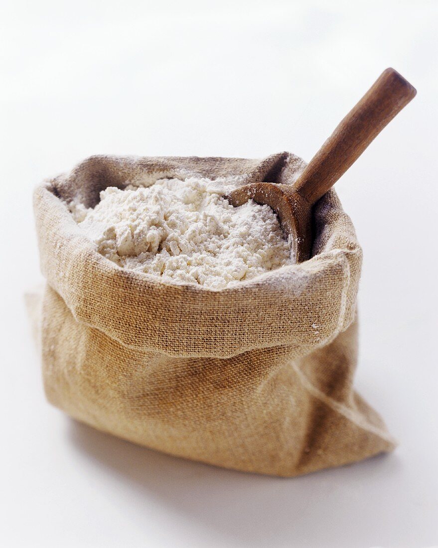 A Sack of Flour with Wooden Scoop
