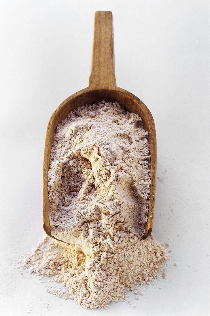 A Wooden Scoop Filled with Flour