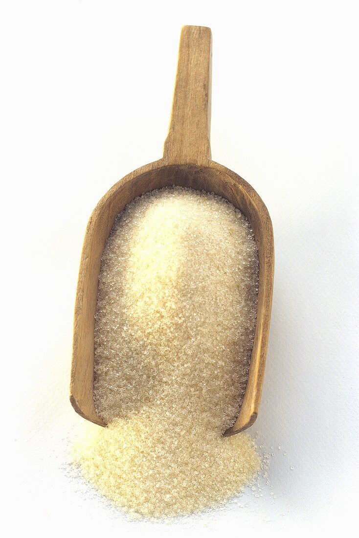 Sugar in a Wooden Scoop