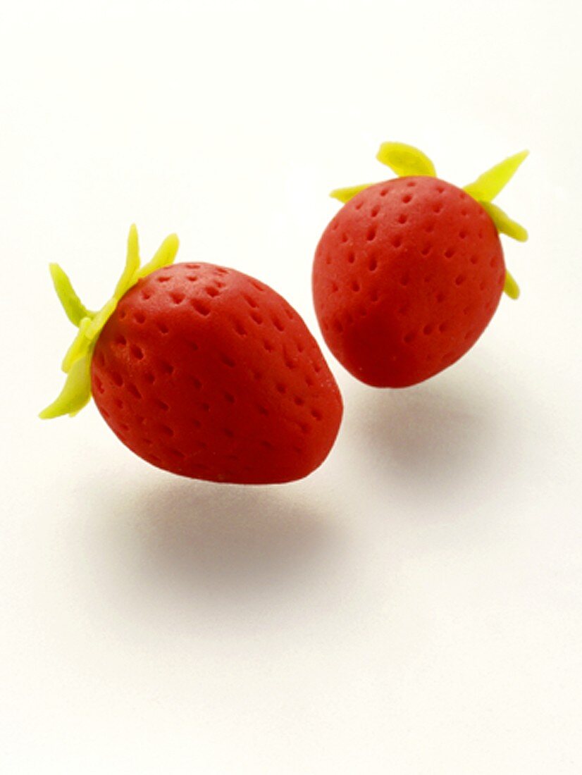 Two marzipan strawberries