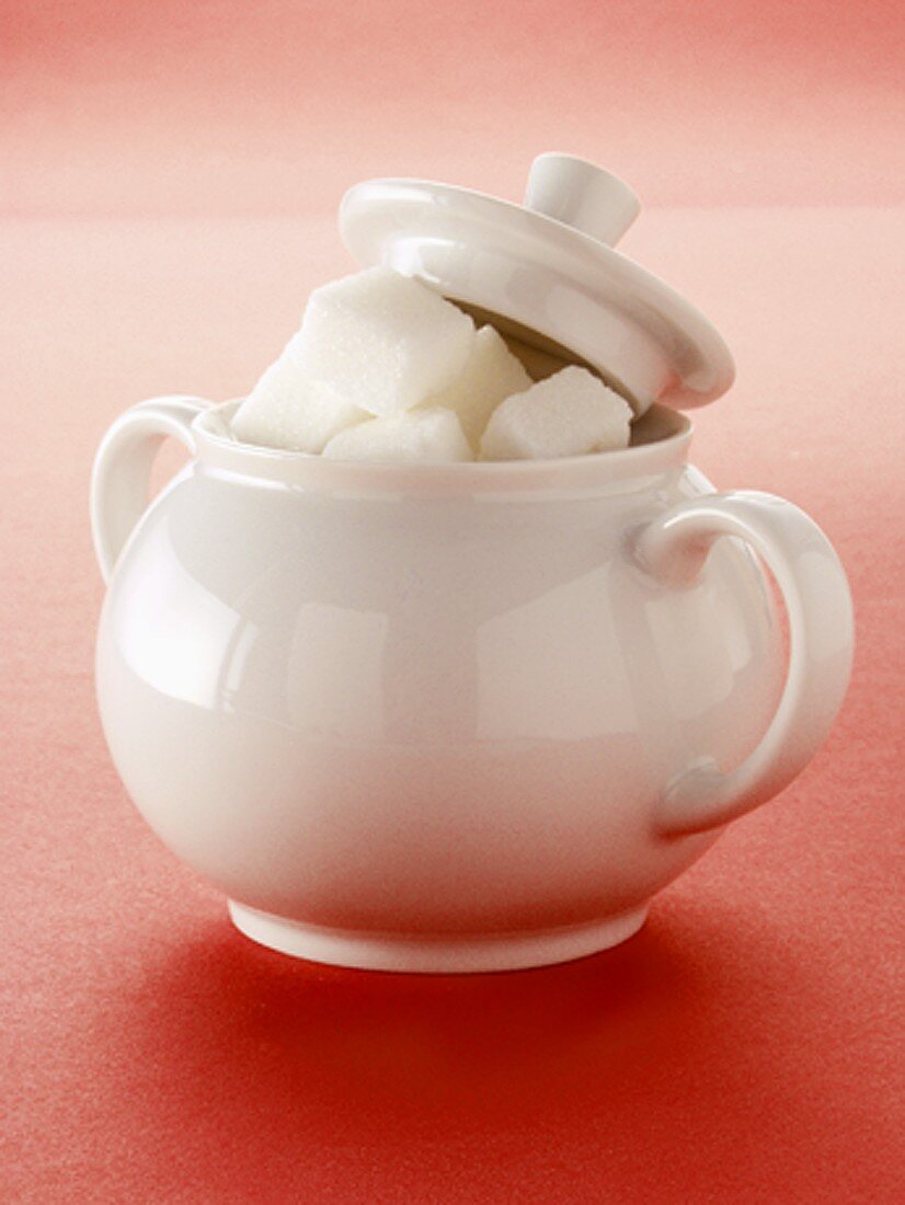 Sugar Cubes in a White Sugar Bowl; Lid