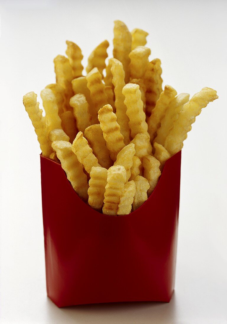 Pommes frites in roter Fast-Food-Box