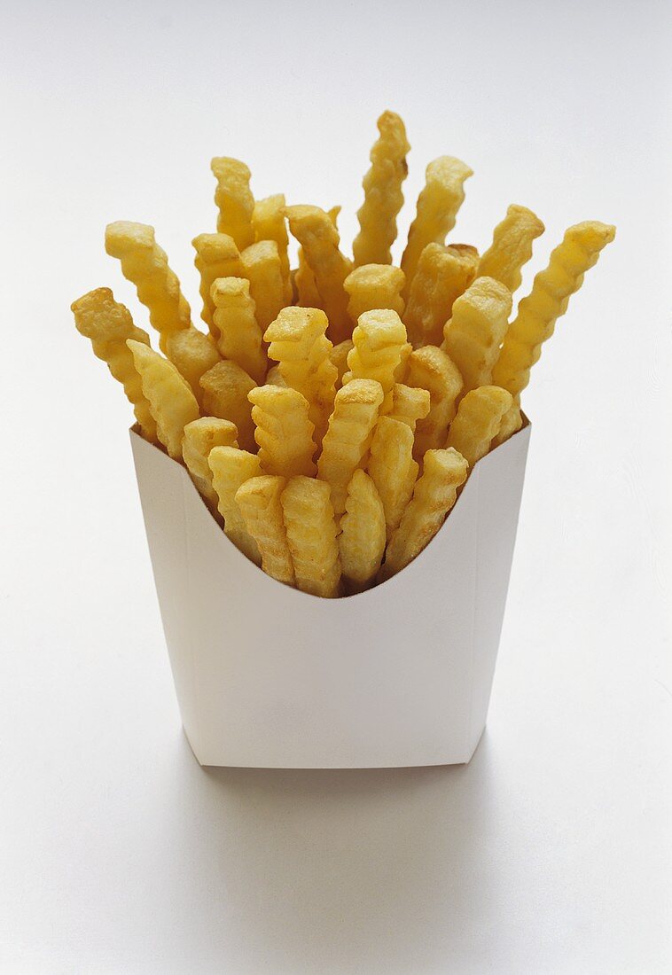 Pommes frites in weisser Fast-Food-Box