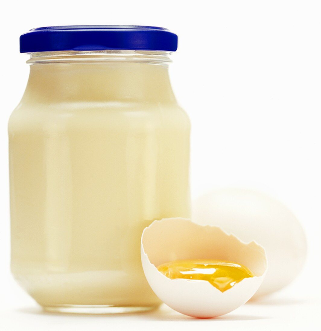 A Jar of Mayonnaise with Egg Yolk in Shell