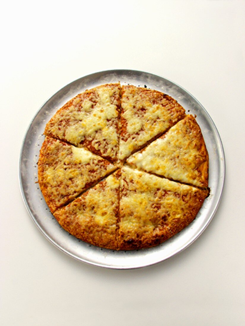 A Sliced Cheese Pizza on a Pan