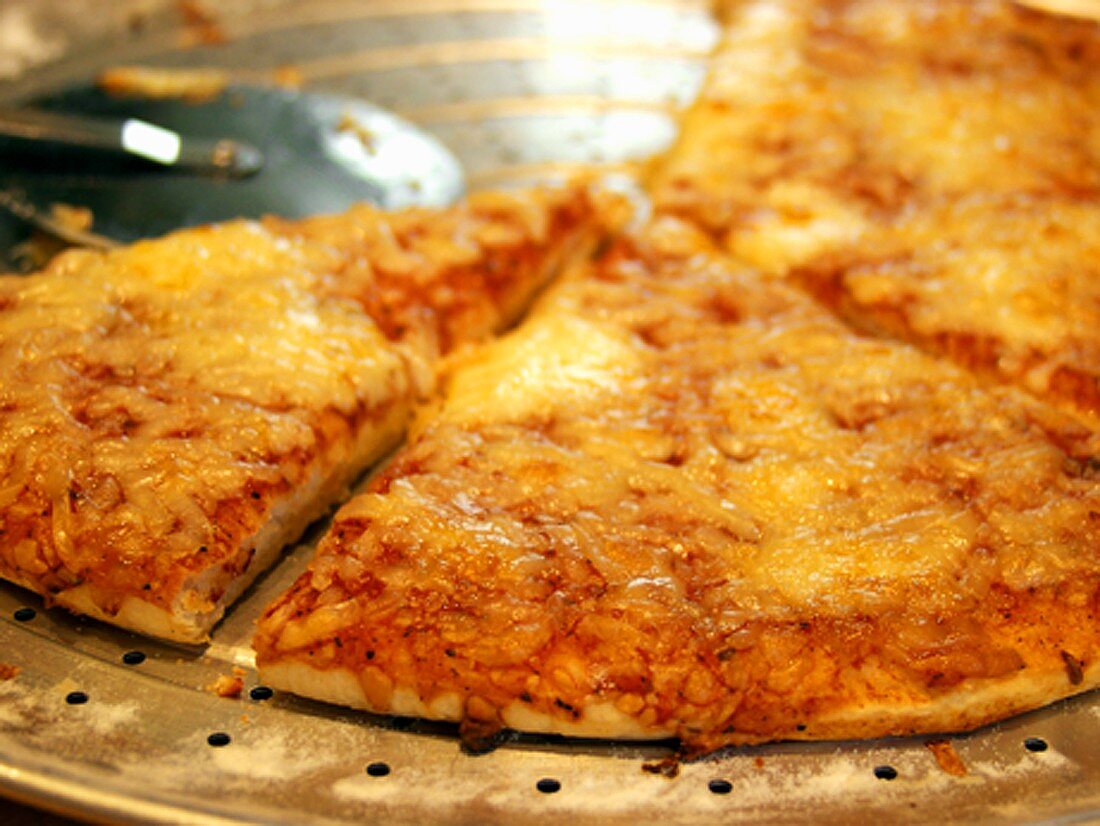 Cheese Pizza on a Pan with Pizza Cutter