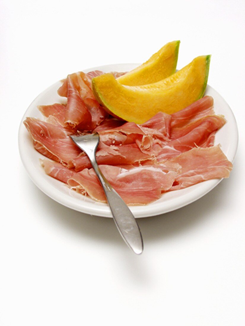 Sliced Procuitto and Melon on Plate with Fork