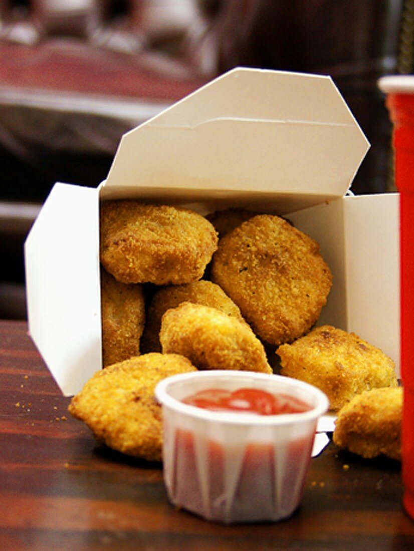Chicken Nuggets in a Take-Out Box with Ketchup