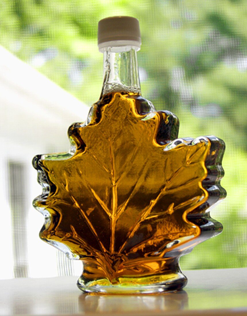 Maple Syrup in a Leaf Shaped Bottle; On Window Sill