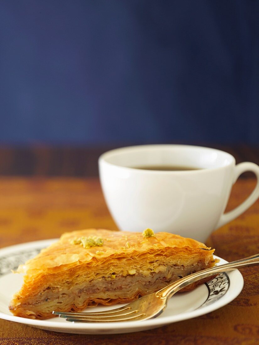A piece of baklava and a cup of tea