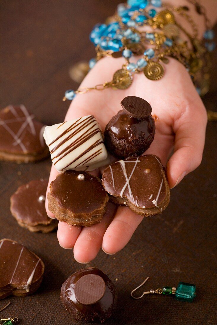 Hand holding Belgian chocolates