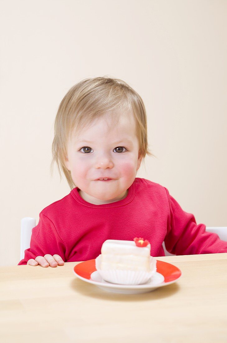Small girl with a white cake