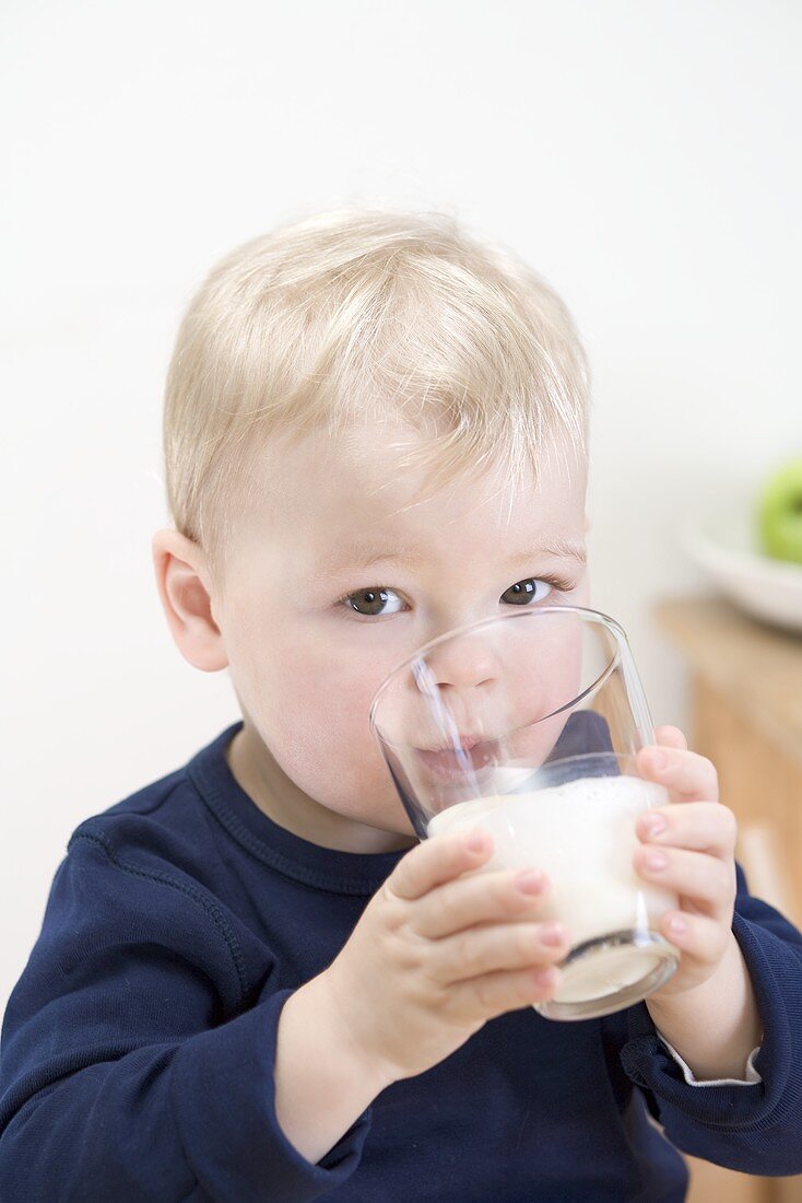 Small boy drinking milk