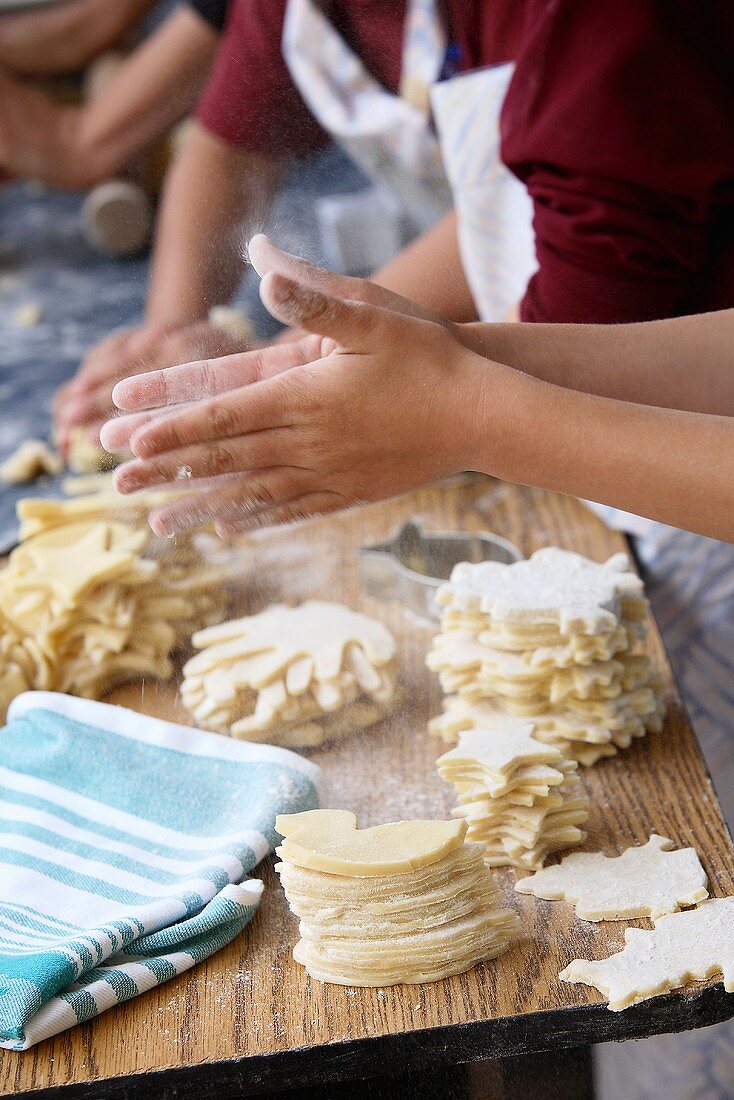 Children baking biscuits (various shapes)