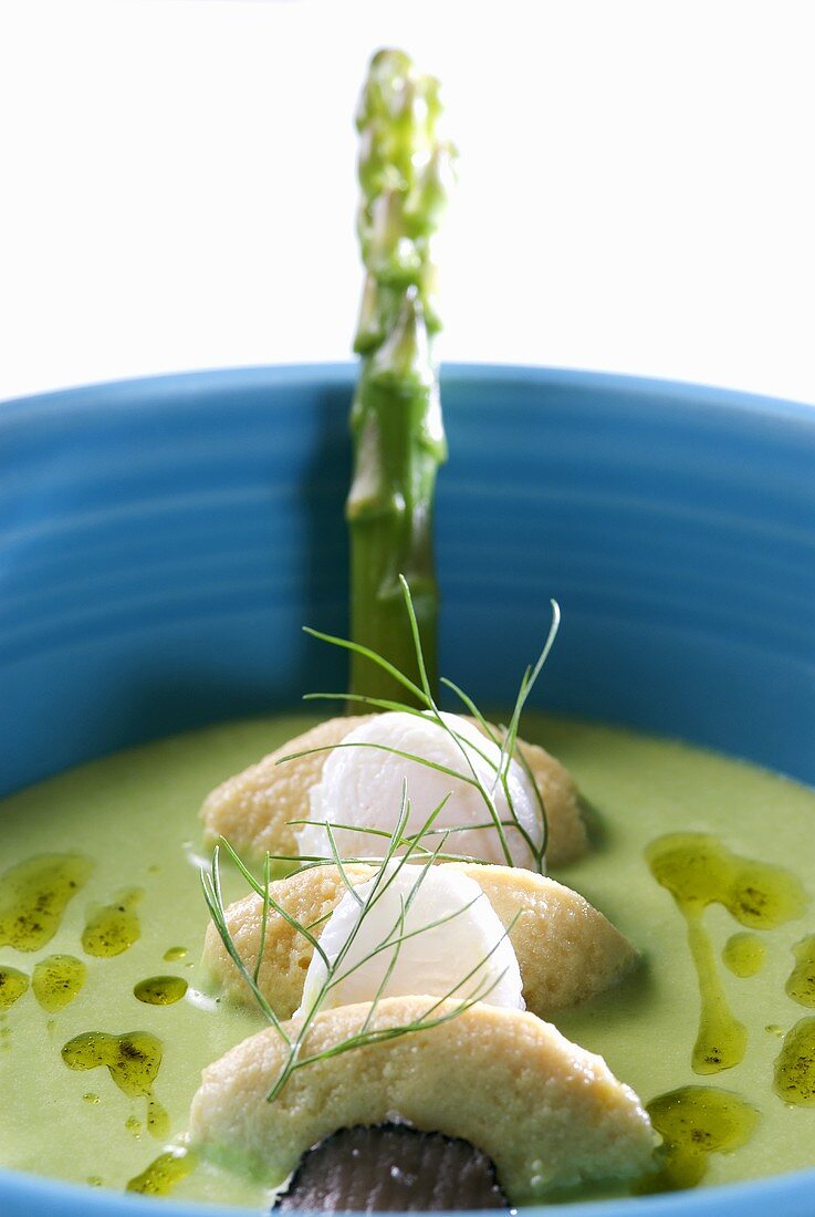 Asparagus cream with fish dumplings, quails' eggs & truffle