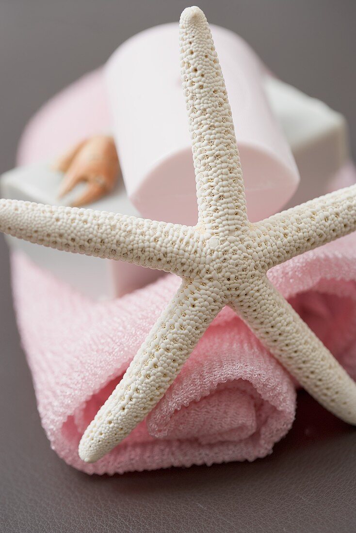 A towel with soap and starfish