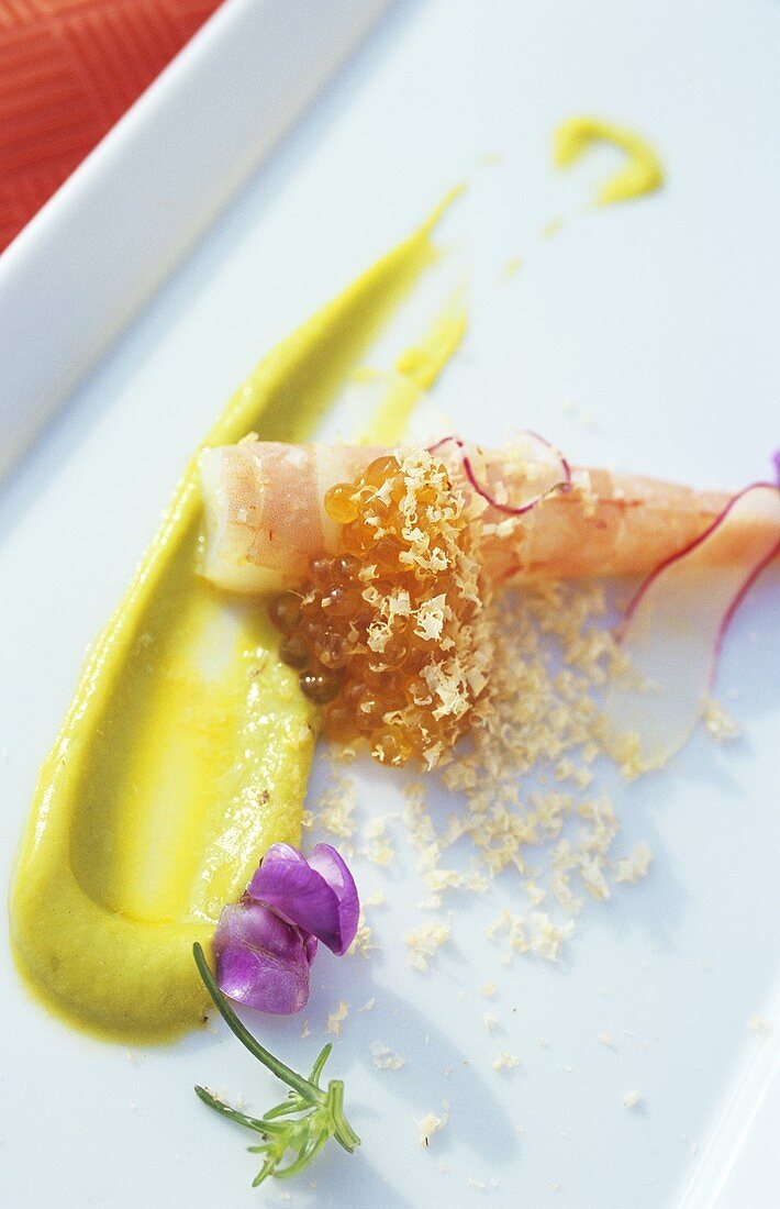 Prawn with citrus avocado sauce and grated hazelnuts