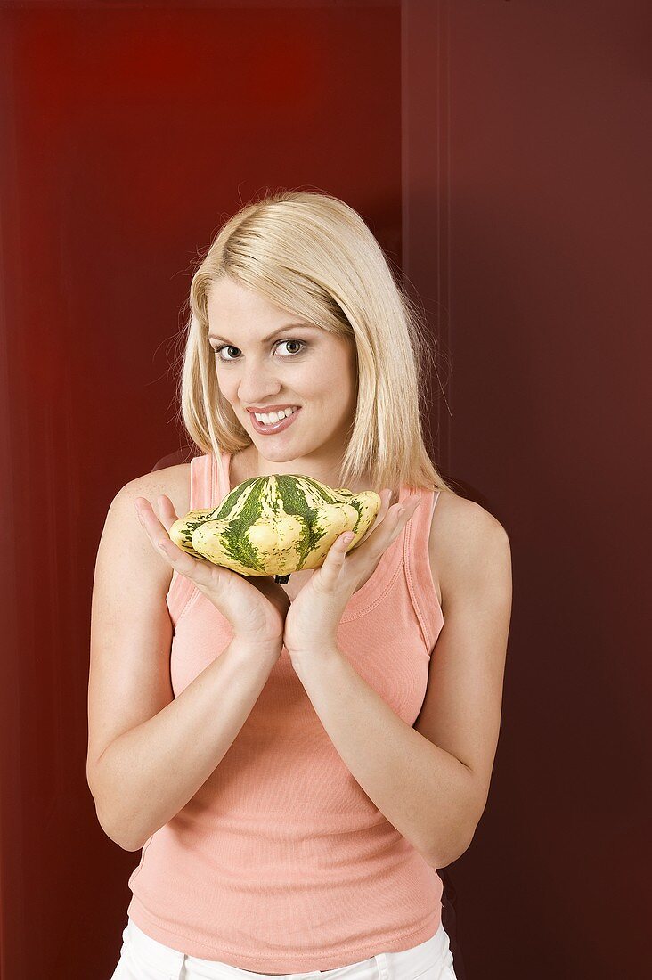 Young woman with squash