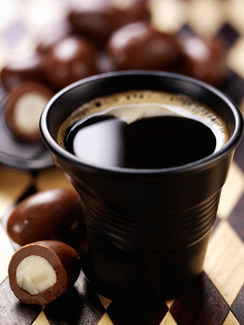 A cup of coffee with chocolates