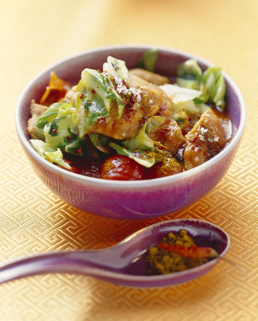 Red catfish curry with cabbage and cocktail tomatoes