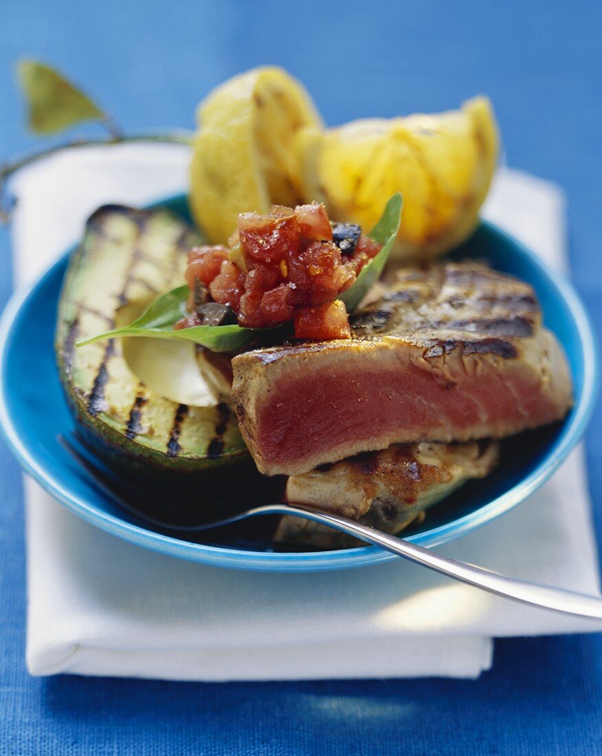 Grilled tuna with avocado and diced tomato
