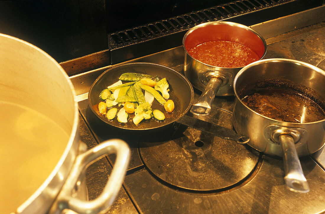 Pans on cooker, Restaurant Le Mas de Peint, France