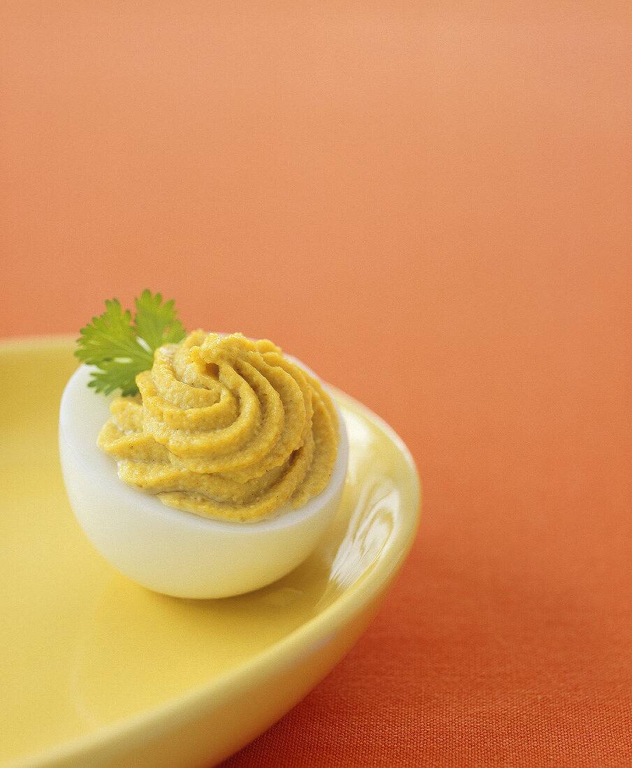 Stuffed egg with curry cream filling