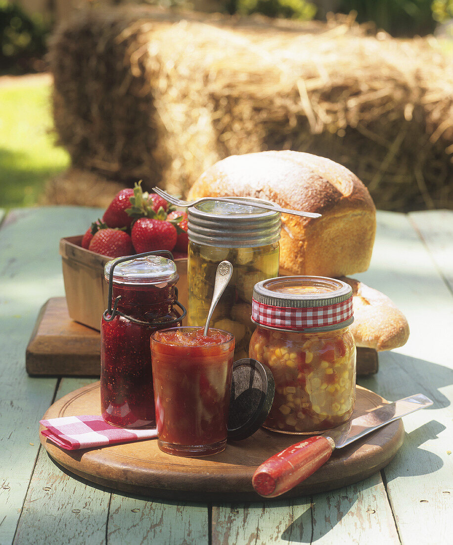 Still life with jam, pickled vegetables and white bread