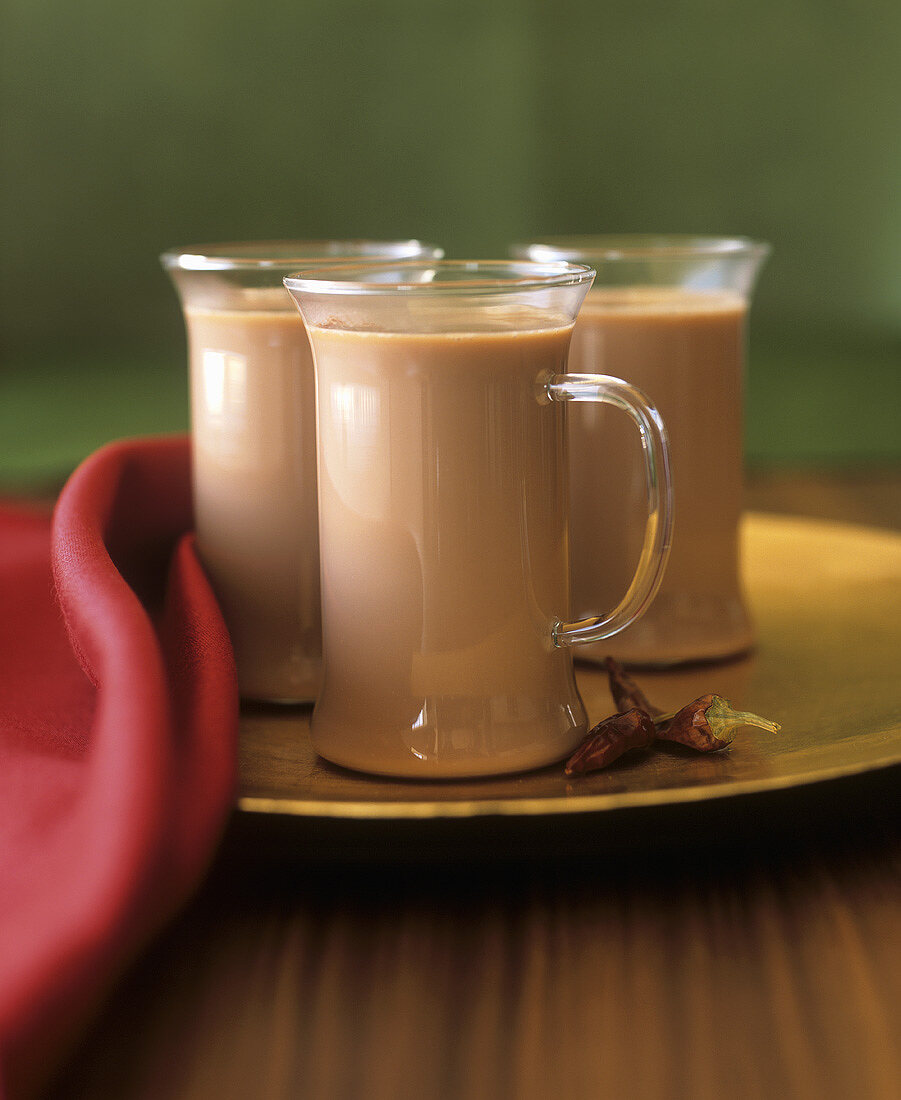 Three glass cups of hot chilli chocolate