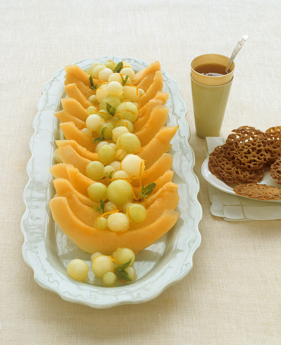 Marinated melon slices on a platter