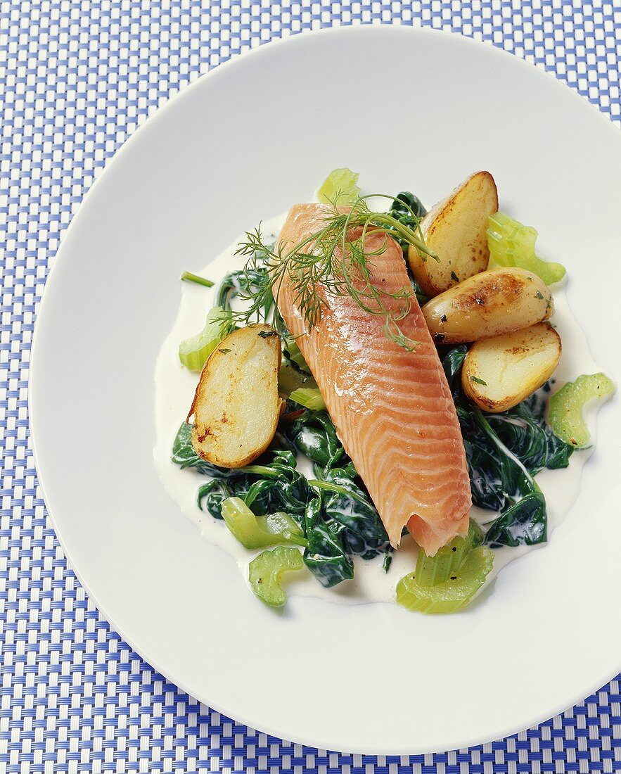 Salmon trout with young spinach, celery and potatoes