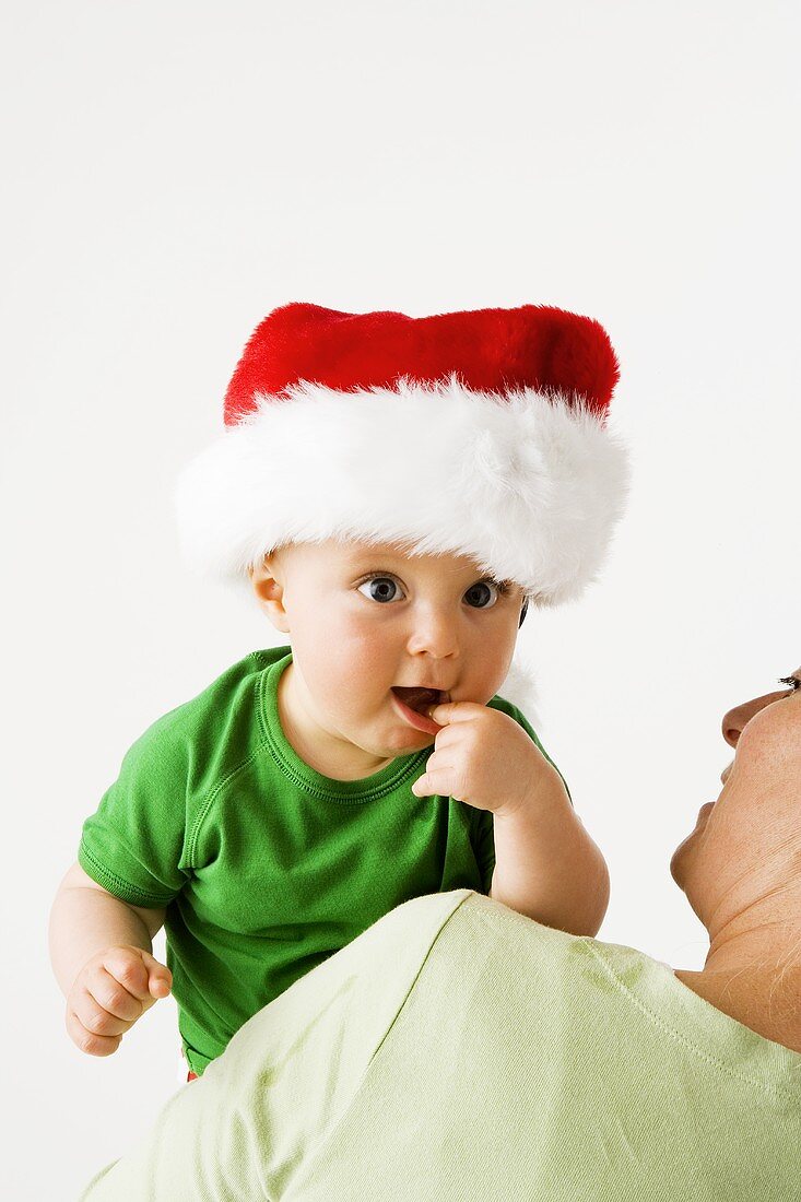 Small boy in Father Christmas hat