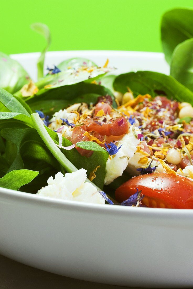 Corn salad with feta, bacon and edible flowers