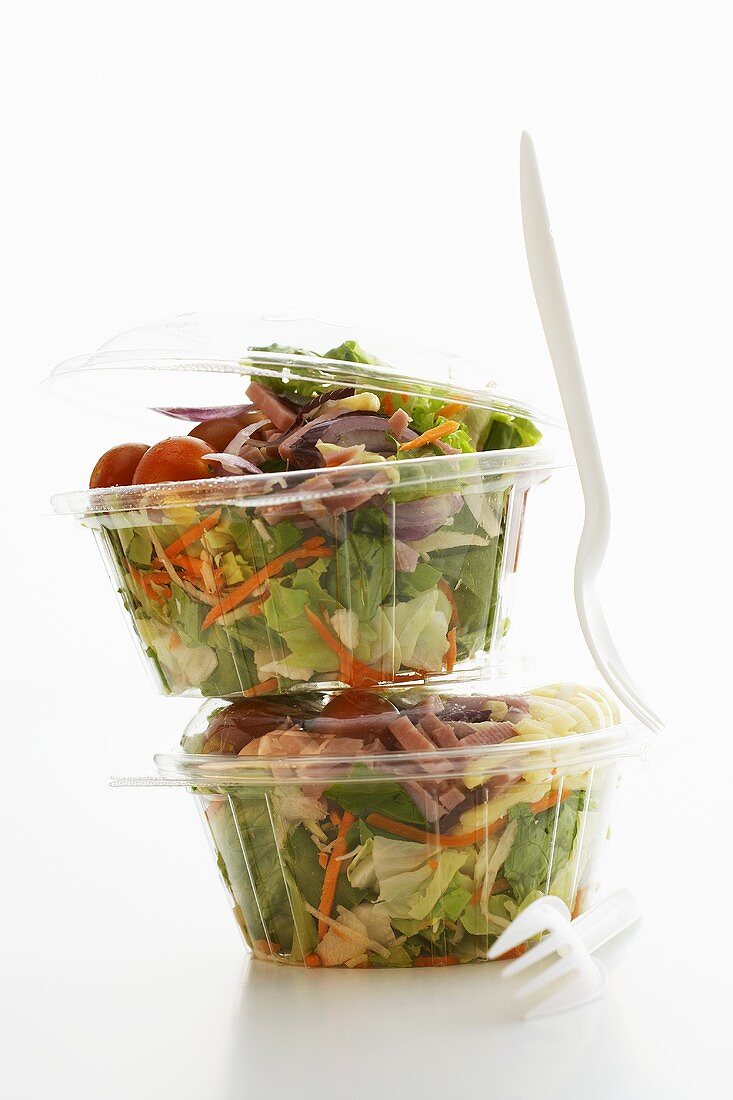 Mixed salad in two plastic containers
