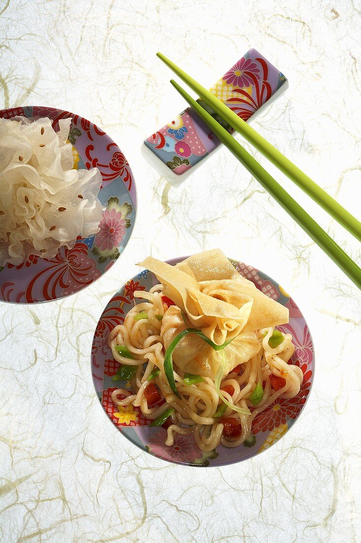 Asian filled dumpling on vegetable noodles