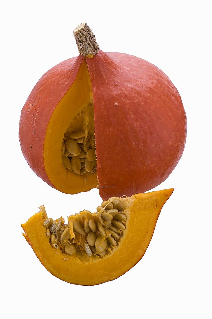 A Hokkaido pumpkin, with a piece cut out