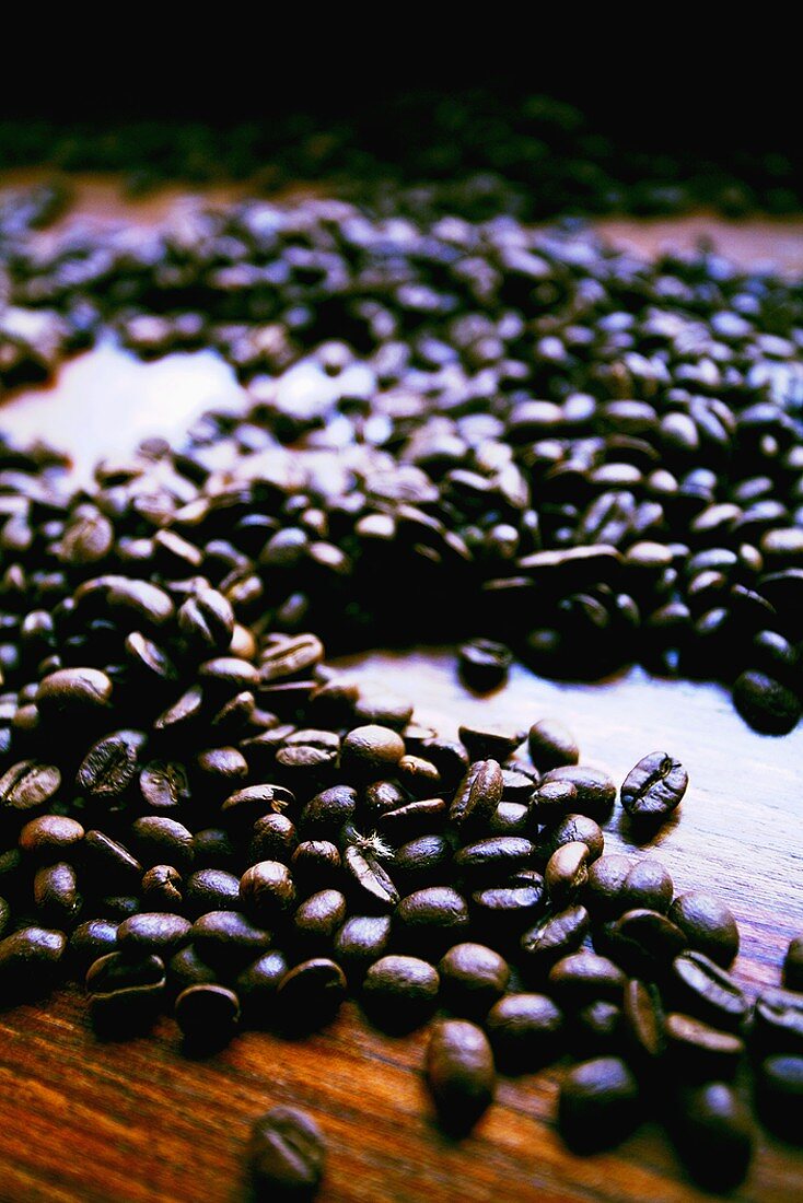 Coffee beans on wooden background