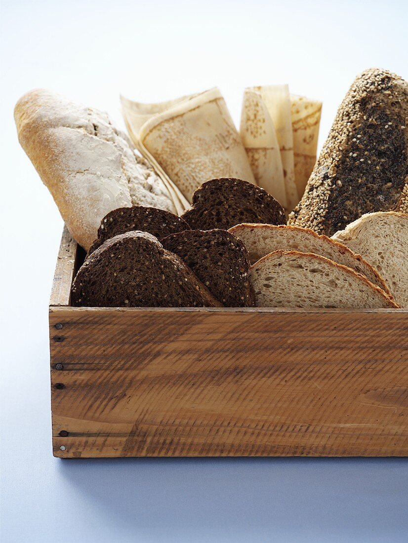 Various sorts of bread in a wooden box