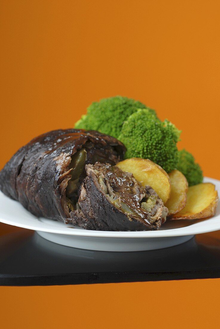 Beef roulade with roast potatoes and broccoli