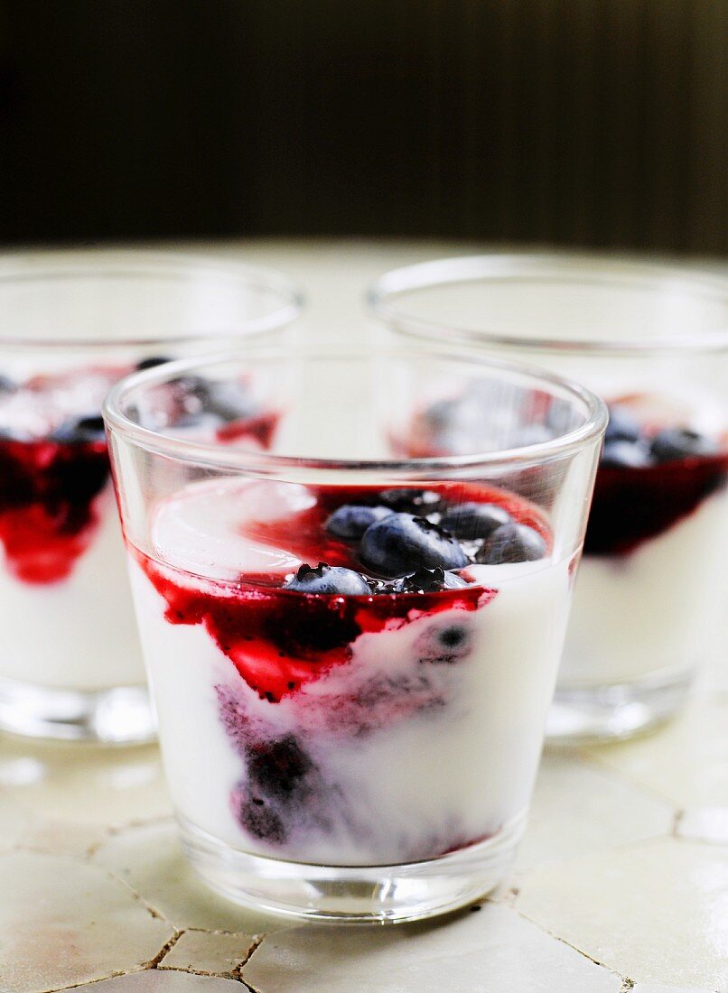 Yoghurt with blueberries in glasses