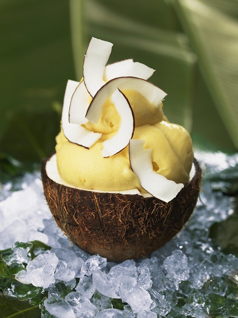 Mango and coconut sorbet in coconut half