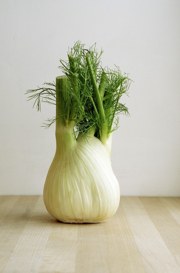 A fennel bulb on a wooden surface