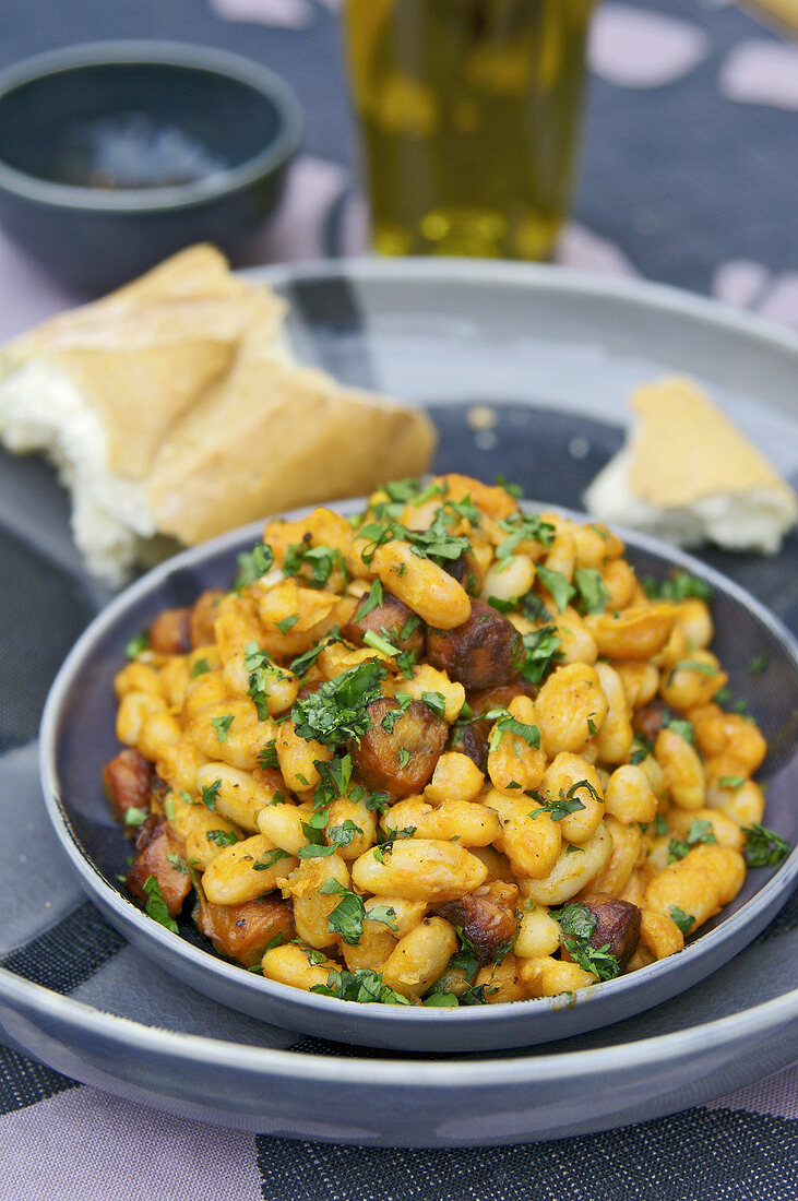 White beans with chorizo and coriander leaves