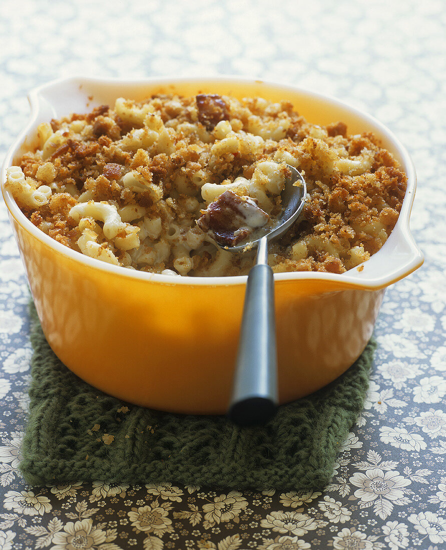 Elbow pasta bake with bacon and cheese in a baking dish